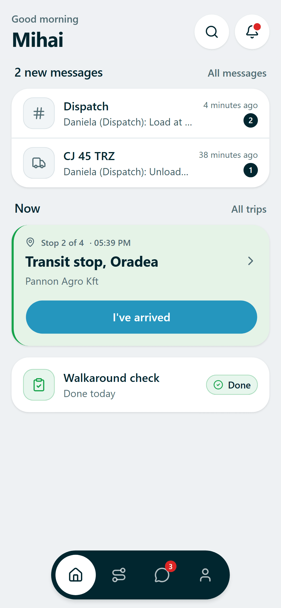 Truckzly Field driver app on a phone. Greeting "Good morning Mihai", two unread messages from dispatch, a green card for stop 2 of 4 in Oradea with an "I've arrived" button, a completed walkaround check, and a bottom navigation bar.