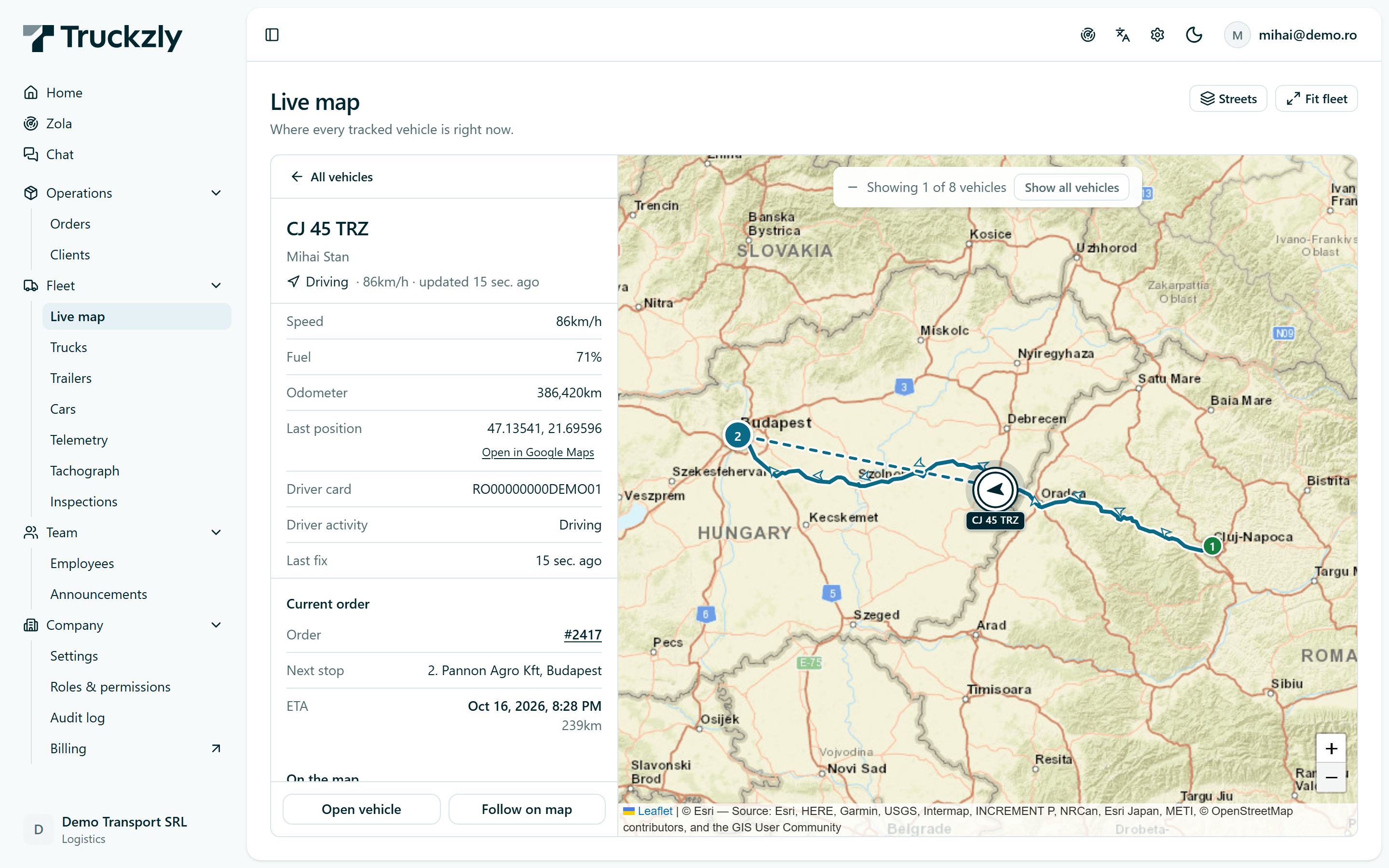 Live map zoomed on truck CJ 45 TRZ near Oradea. The side panel shows driver Mihai Stan driving at 86 km/h, 71 percent fuel, odometer, driver card, order 2417 with next stop Budapest and an ETA with 268 km remaining.